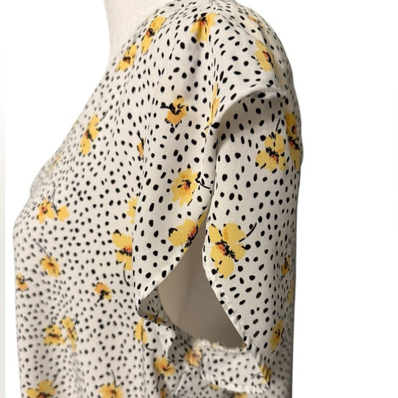 Lily White v neck top with black design with yellow flowers. Hi-Lo Size Medium - Picture 3 of 8